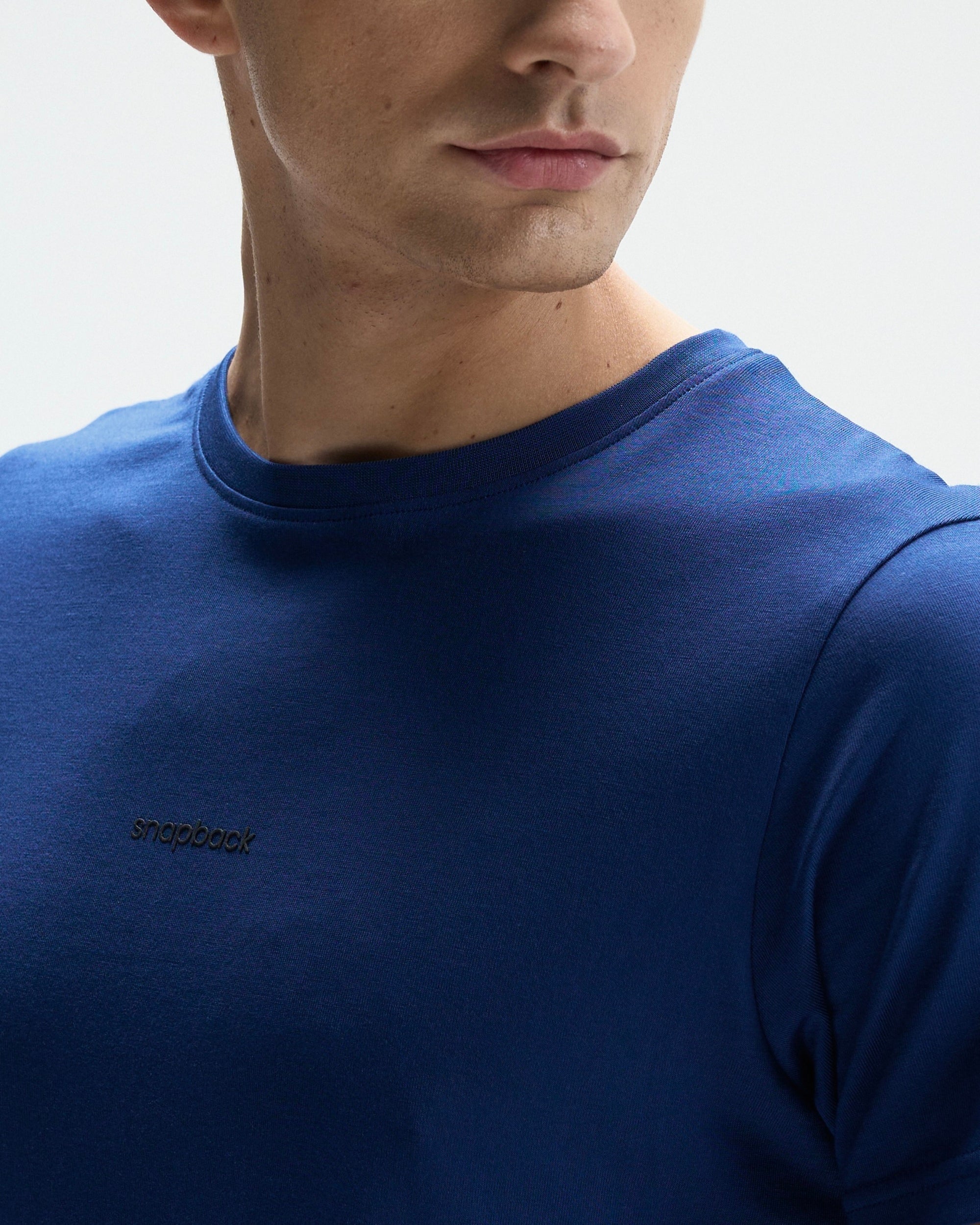 Navy blue Supima cotton crew neck t-shirt with small black logo on chest, regular fit.